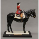 A Coalport porcelain model of Trooping The Colour. 31 cm high.