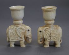 A pair of bone elephant candlesticks. 9.5 cm high.