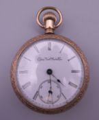 An Elgin gold plated pocket watch. 5.5 cm diameter.