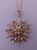 A Victorian 9 ct gold seed pearl pendant on chain. The pendant 4 cm high. 5.8 grammes total weight.