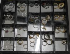 A quantity of dress rings and earrings.