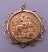 A 1906 sovereign in a 9 ct gold mount. 9.5 grammes.