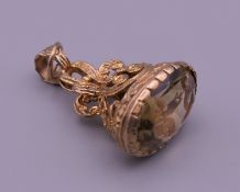A 9 ct gold and citrine fob seal. 3.5 cm high. 8.6 grammes total weight.