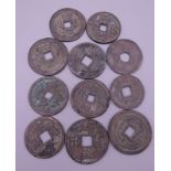 Eleven Chinese coins.