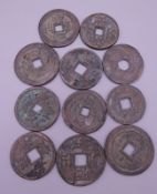 Eleven Chinese coins.