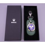 A boxed Rolex key ring.