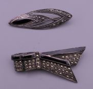 Two silver marcasite brooches. The largest 5.5 cm wide.