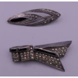 Two silver marcasite brooches. The largest 5.5 cm wide.