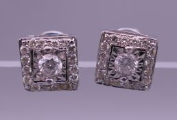 A pair of 22 ct gold Art Deco style square diamond earrings. 7 mm squared.