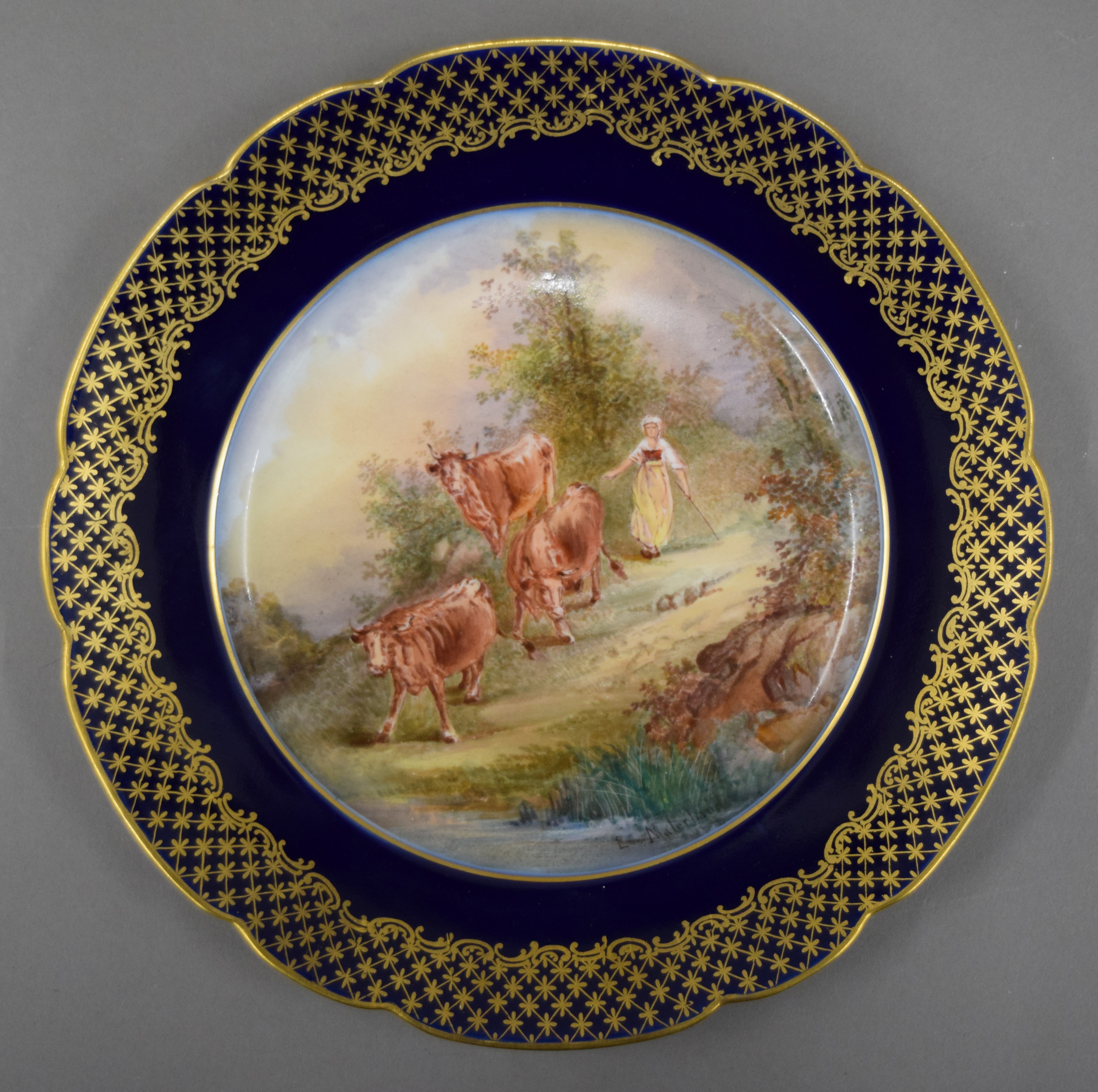 A Continental porcelain plate painted with cattle, signed L Malerbaud. 23 cm diameter. - Image 2 of 3