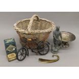 A quantity of miscellaneous items in a basket, including silver plate, tins, etc.