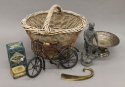 A quantity of miscellaneous items in a basket, including silver plate, tins, etc.