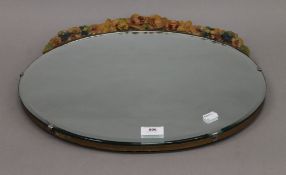 An oval Barbola mirror. 45.5 cm wide.