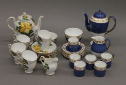 A Tuscan tea set and a Wedgwood coffee set.