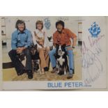 A Blue Peter signed photograph and badge.