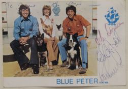 A Blue Peter signed photograph and badge.