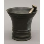 An 18th century bronze pestle and mortar. 15.5 cm high.