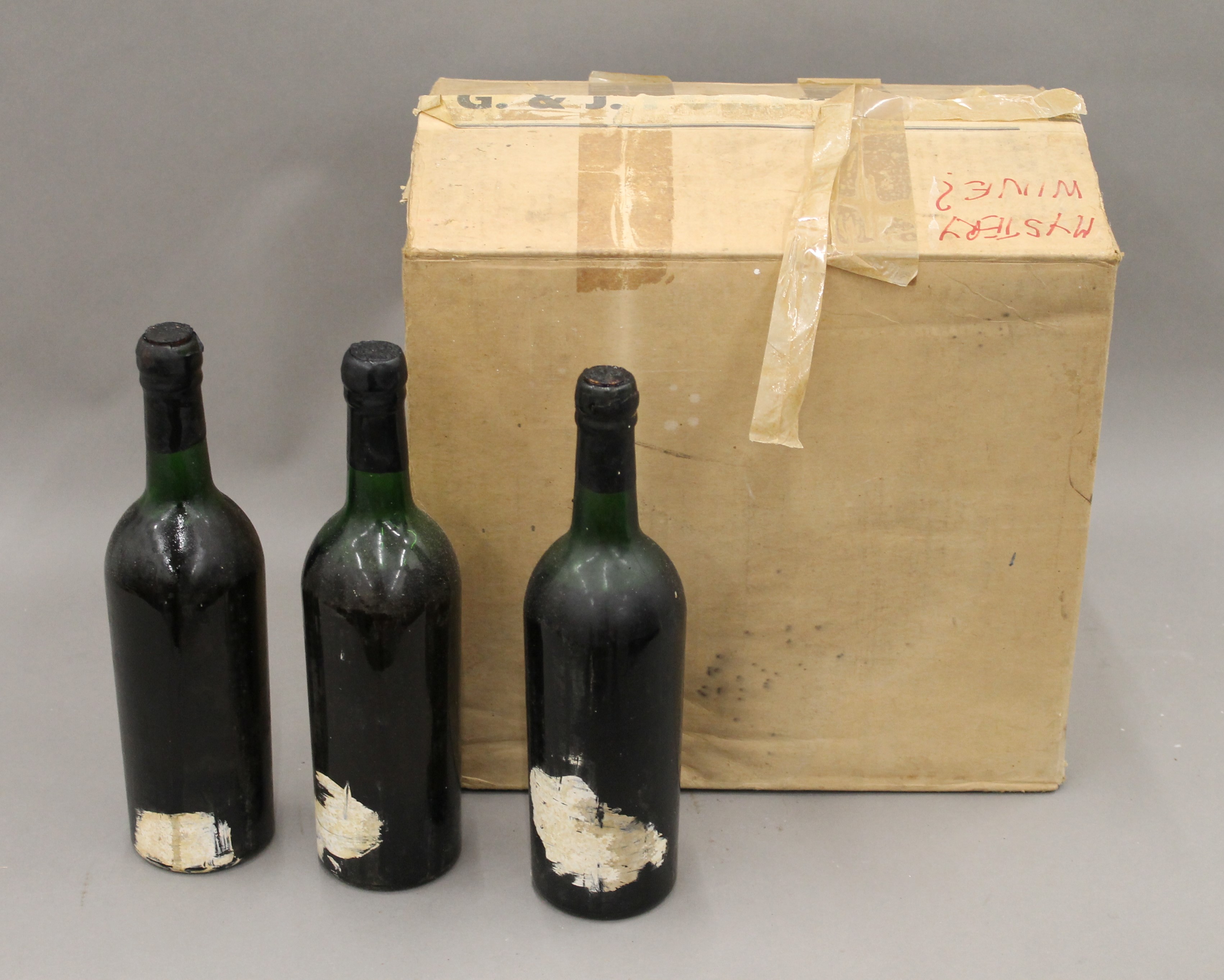 A box of twelve bottles of vintage Grahams Port, eleven dated 1963 and one dated 1960,