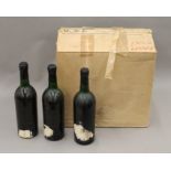 A box of twelve bottles of vintage Grahams Port, eleven dated 1963 and one dated 1960,