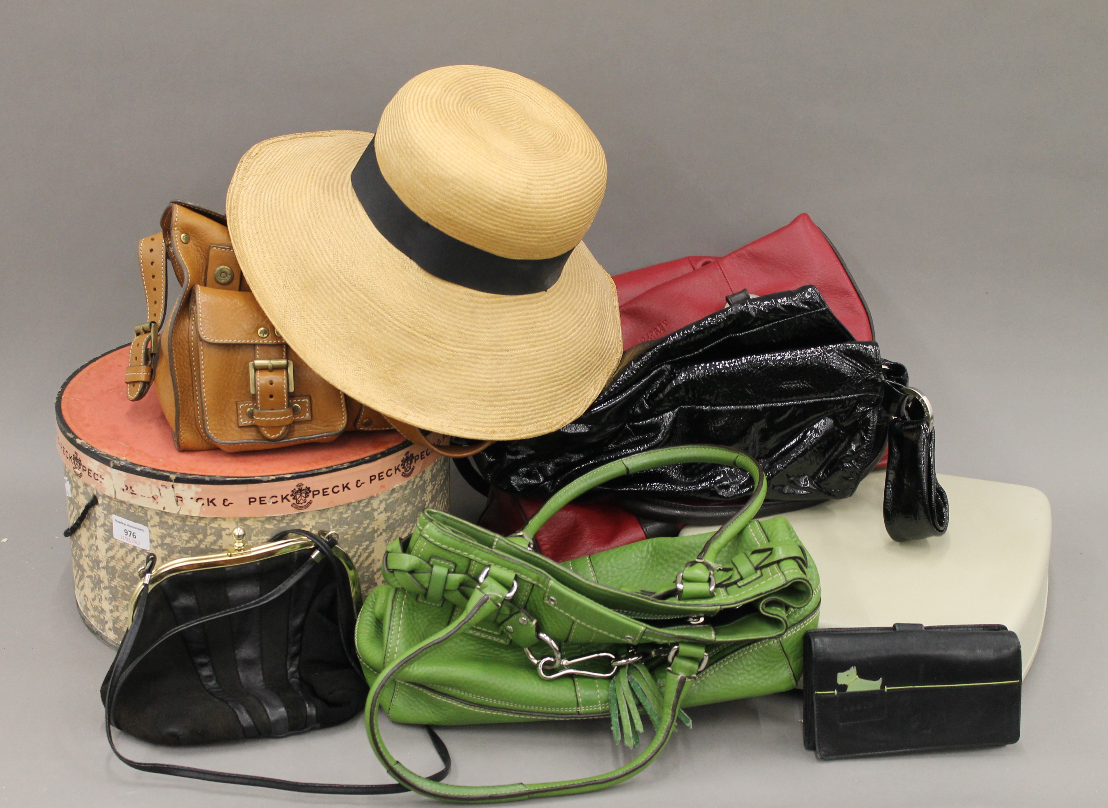 A vintage hat, various handbags and a typewriter.
