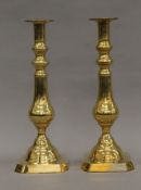 A pair of Edwardian brass candlesticks. 30.5 cm high.