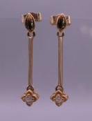 A pair of 9 ct gold and diamond drop earrings. 3 cm high.