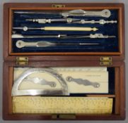 A quantity of Victorian drawing instruments in a fitted wooden box. 19 cm wide.