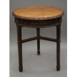 A Victorian mahogany topped cast iron pub table. 59 cm diameter.
