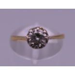 An 18 ct gold and platinum 0.50 carat diamond solitaire ring. Ring size K. 1.8 grammes total weight.