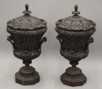 A pair of large ornate lidded urns. 84 cm high.