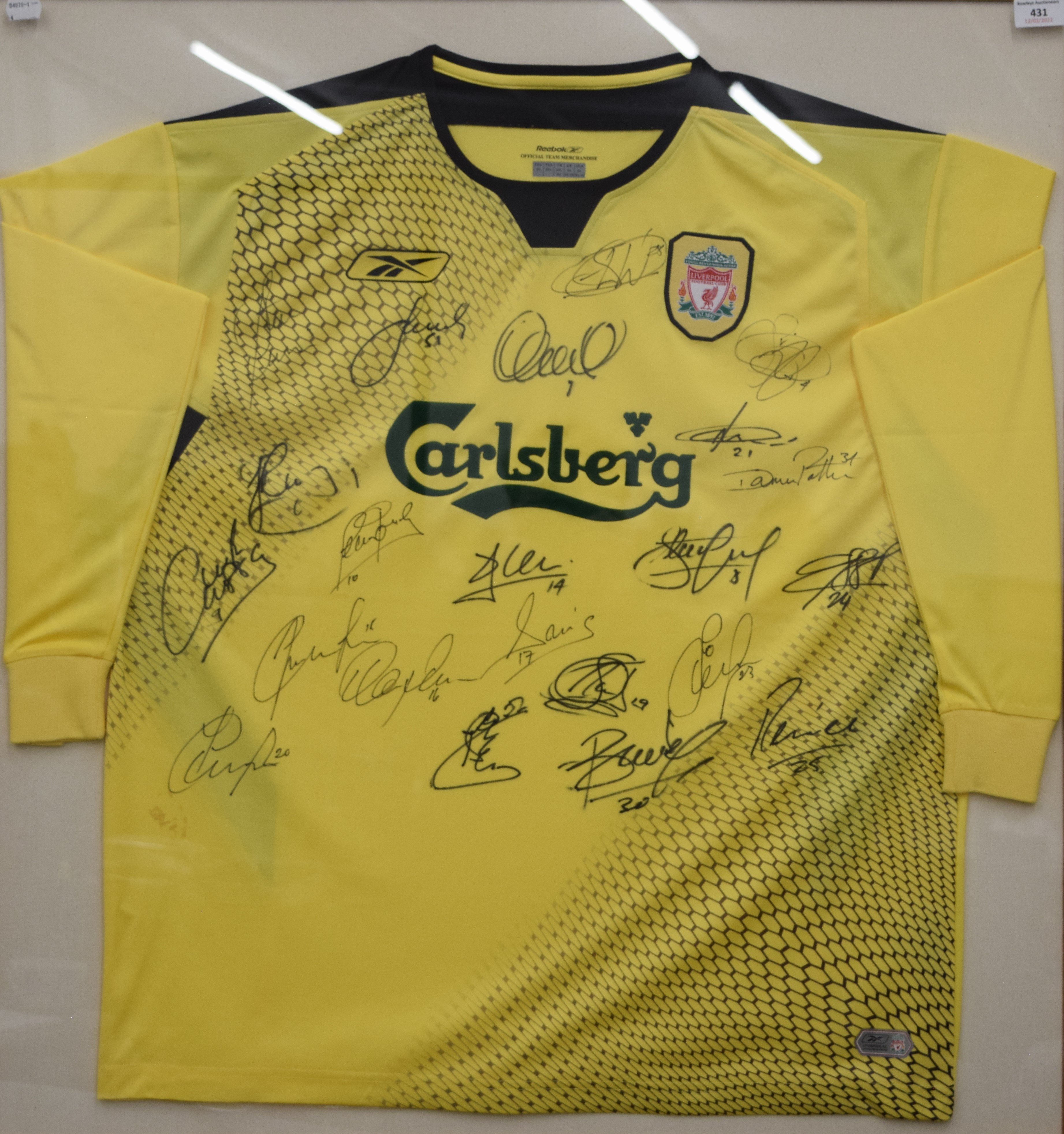 A Liverpool away football shirt signed by: Jerzy Dudek (1), Steve Finnan (3), Jamie Carragher (23),