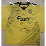 A Liverpool away football shirt signed by: Jerzy Dudek (1), Steve Finnan (3), Jamie Carragher (23),