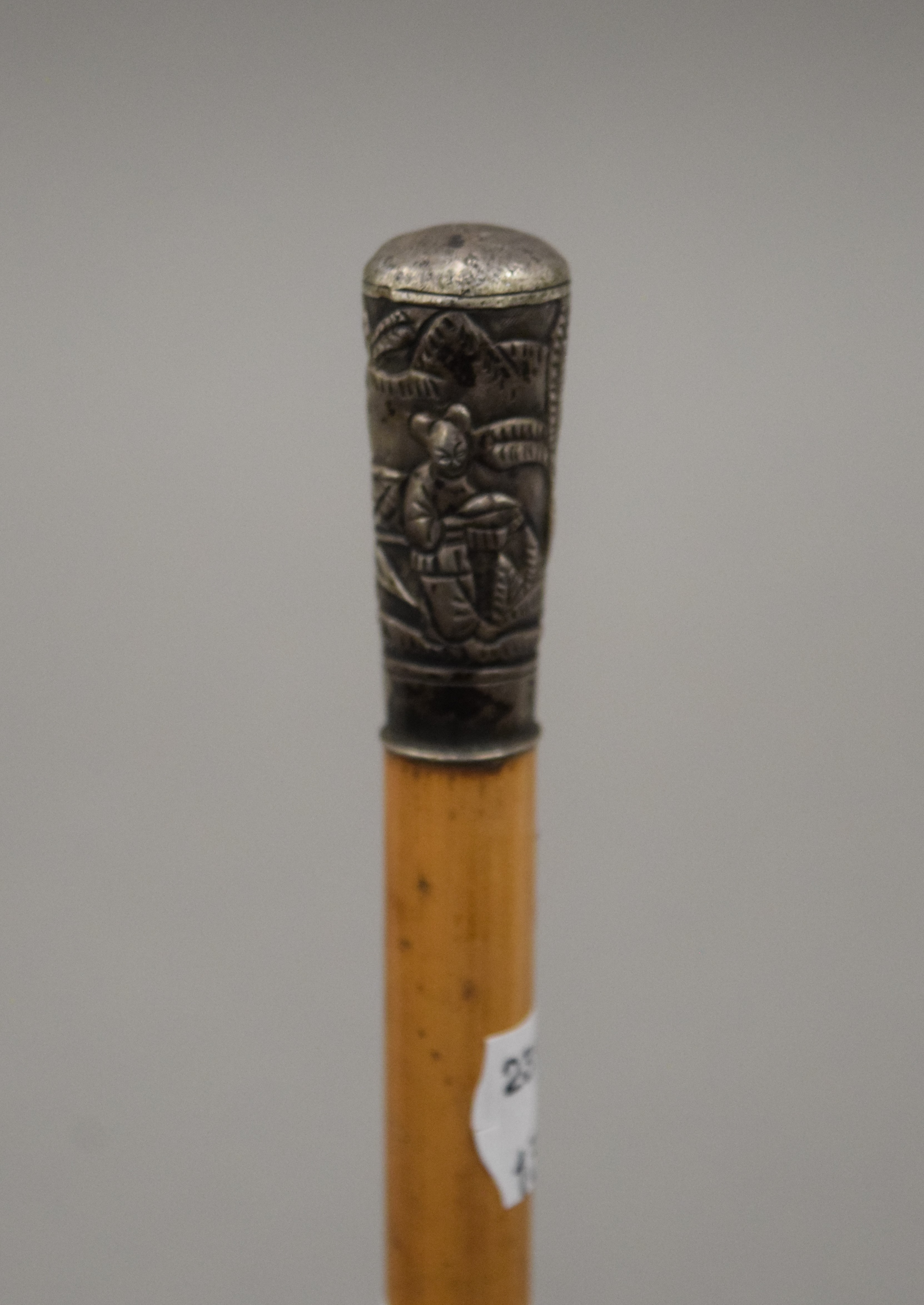 A Chinese silver topped walking cane. 81 cm long.