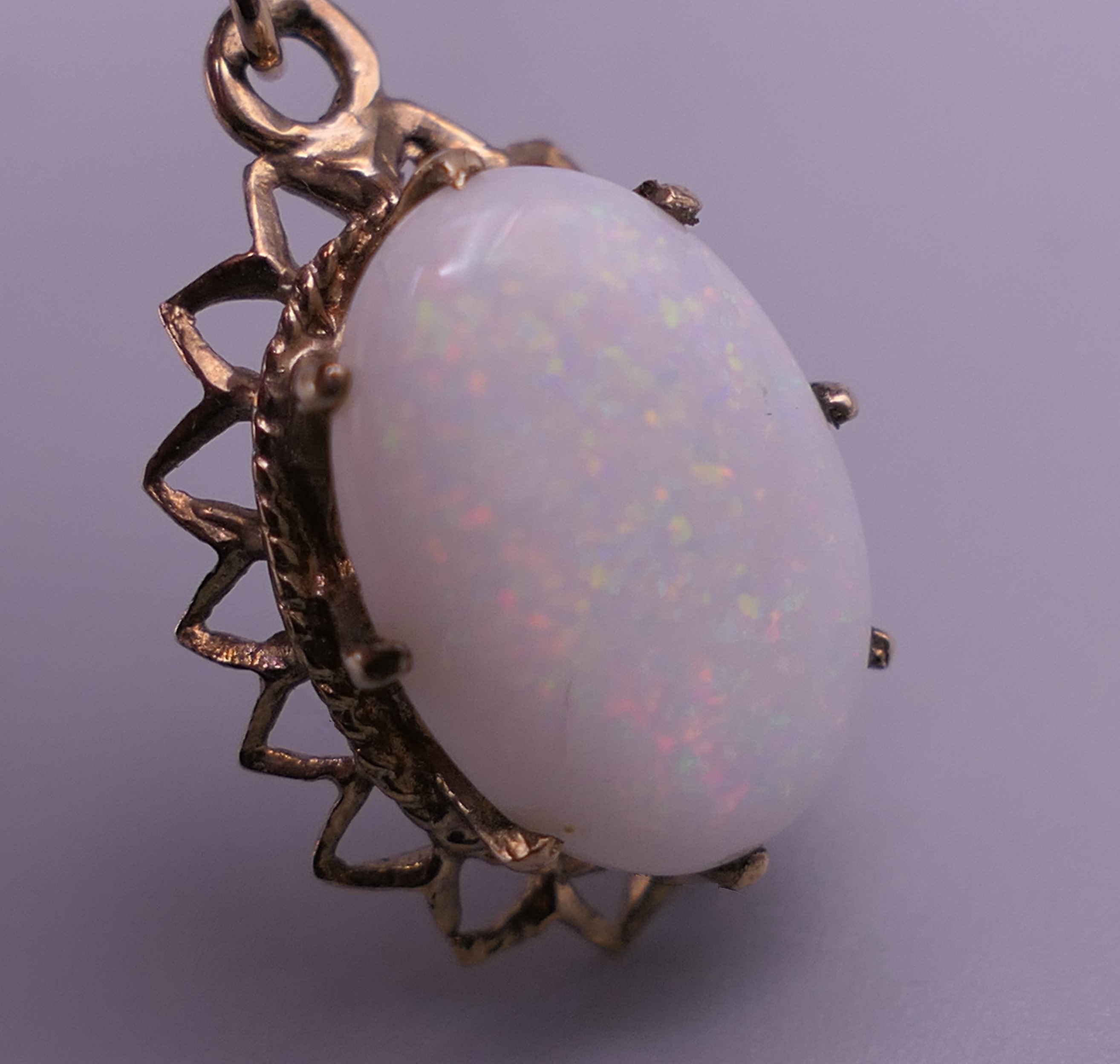A 9 ct gold and opal pendant on chain. The pendant 2 cm high. 2.8 grammes total weight. - Image 5 of 7