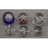 A small collection of paperweights.
