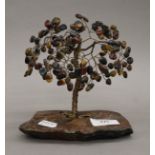 A Chinese miniature tree decorated with tiger's eye and other semi-precious stones. 15 cm high.