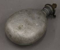 An unusual aluminium powder flask. 22 cm high.