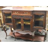 An Edwardian mahogany side cabinet. 136 cm wide.