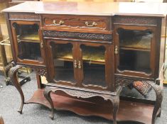 An Edwardian mahogany side cabinet. 136 cm wide.