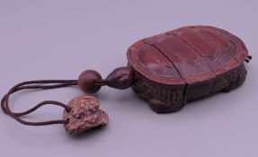 A Japanese turtle form inro. 9.5 cm long.