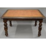 A Victorian carved oak table with leather inset top. 136 cm long x 105 cm wide.