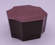 A small Chinese lacquered box with red seal mark. 6.25 cm wide.
