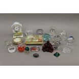 A collection of paperweights and miscellaneous items.