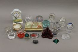 A collection of paperweights and miscellaneous items.