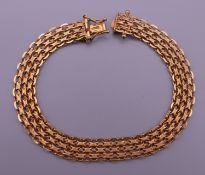 A 9 ct gold bracelet. 18 cm long. 10.8 grammes.