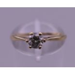 A 9 K gold 0.25 carat diamond solitaire ring. Ring size M. 1.1 grammes total weight.