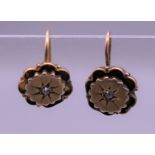 A pair of Victorian gold diamond set earrings. 2.8 grammes total weight.