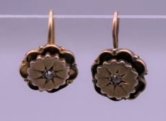 A pair of Victorian gold diamond set earrings. 2.8 grammes total weight.