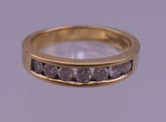 An 18 K gold .50 carat diamond ring. Ring size O. 4.5 grammes total weight.