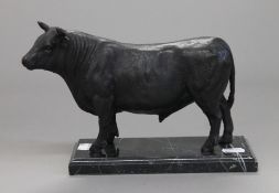 A bronze model of a bull. 25 cm long.